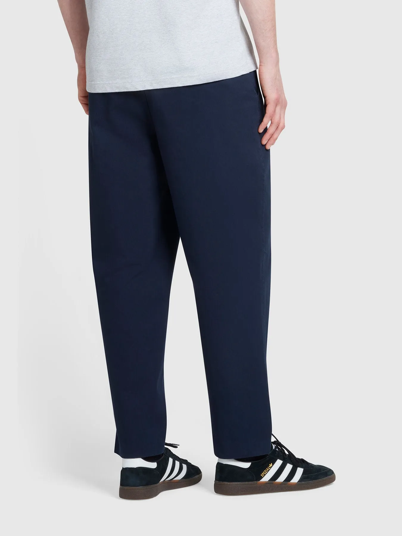 Hawtin Relaxed Tapered Fit Popperback Trousers In True Navy